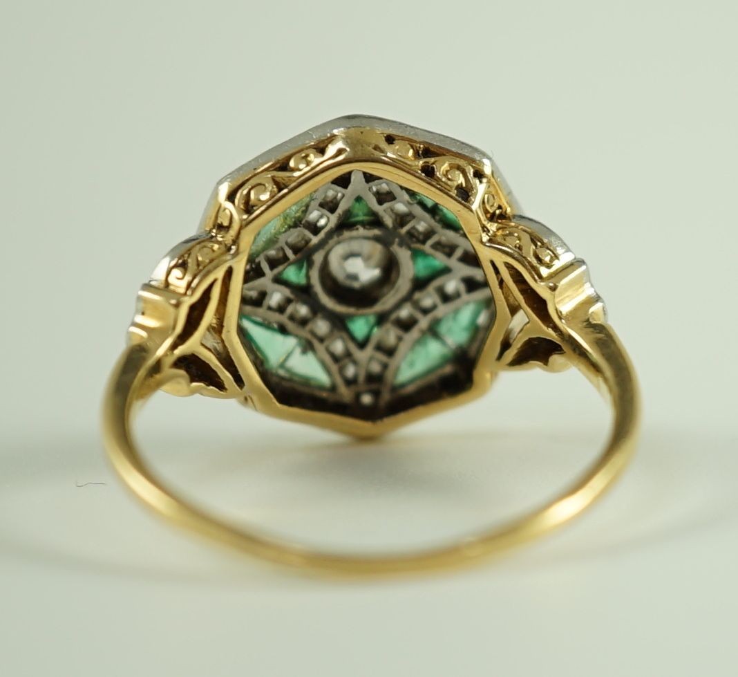 A Belle Epoque gold, emerald and diamond cluster set octagonal dress ring